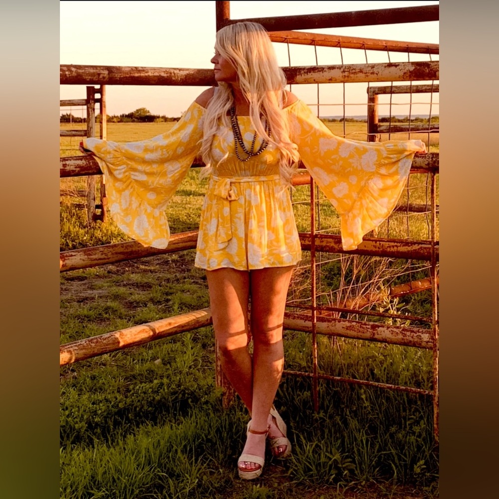 Mustard floral belle sleeve romper worn twice and only dry cleaned size s